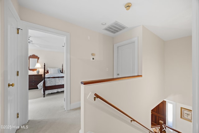 2000 Marsh Harbor Pl, Wilmington, NC 28405 - corridor featuring an upstairs landing and light carpet