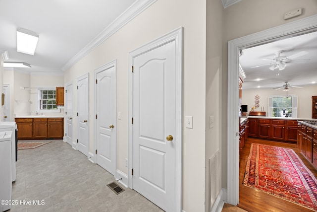 2000 Marsh Harbor Pl, Wilmington, NC 28405 - hallway featuring crown molding and a sink
