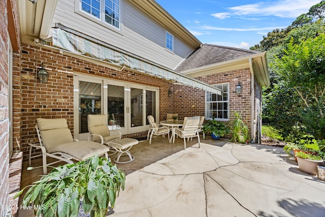 2000 Marsh Harbor Pl, Wilmington, NC 28405 - view of patio featuring french doors and outdoor dining area