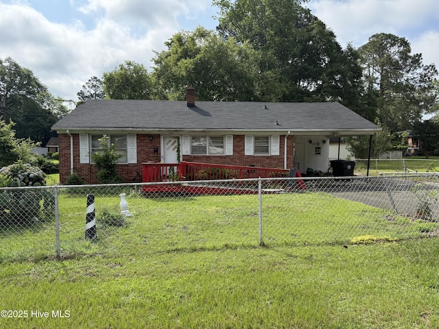 718 Franklin St, Goldsboro, NC 27530 - view of front of house with brick siding, an attached carport, driveway, and a chimney