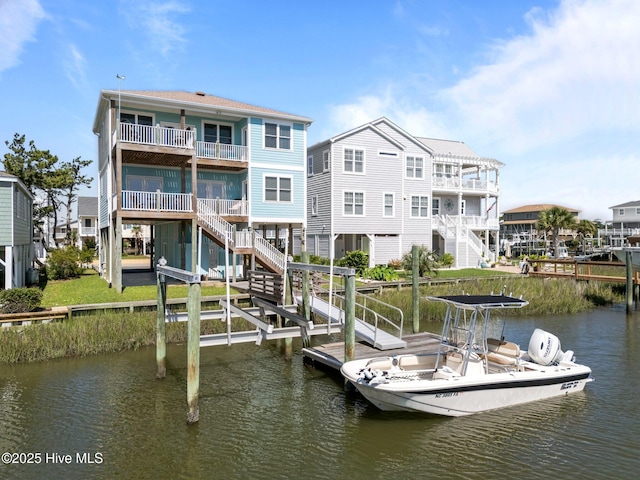 130 Raleigh St, Holden Beach, NC 28462 - dock featuring a water view and stairway
