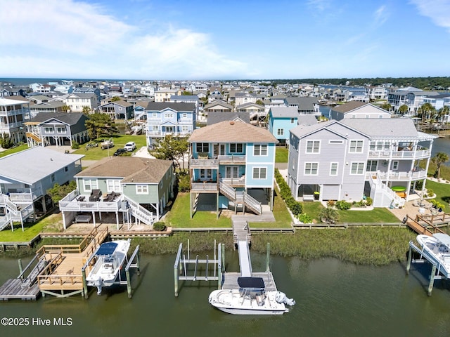 130 Raleigh St, Holden Beach, NC 28462 - aerial view of residential area featuring a large body of water
