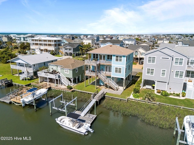 130 Raleigh St, Holden Beach, NC 28462 - aerial perspective of suburban area featuring a nearby body of water