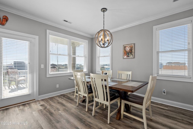 130 Raleigh St, Holden Beach, NC 28462 - dining space with a chandelier, wood finished floors, and crown molding
