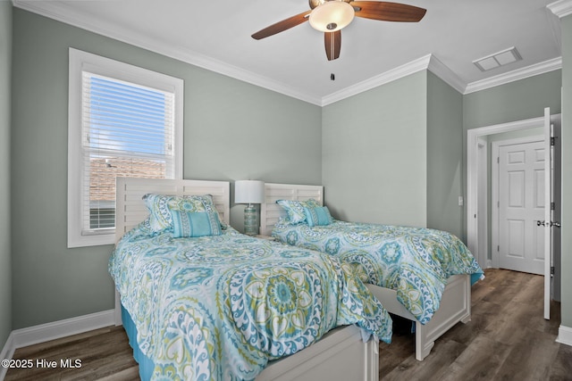 130 Raleigh St, Holden Beach, NC 28462 - bedroom with ornamental molding, wood finished floors, and a ceiling fan