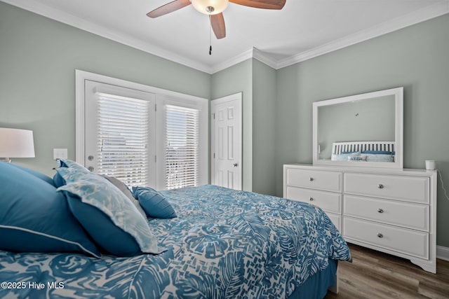 130 Raleigh St, Holden Beach, NC 28462 - bedroom with ornamental molding, dark wood-style flooring, and ceiling fan