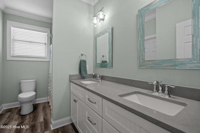 130 Raleigh St, Holden Beach, NC 28462 - full bath with ornamental molding, wood finished floors, and double vanity