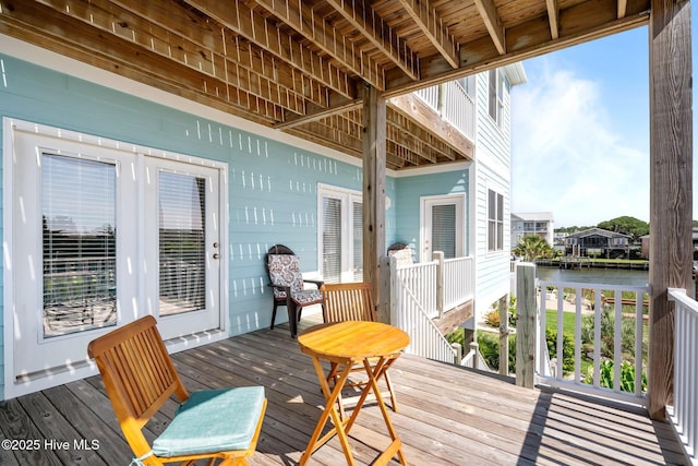130 Raleigh St, Holden Beach, NC 28462 - wooden deck featuring a water view