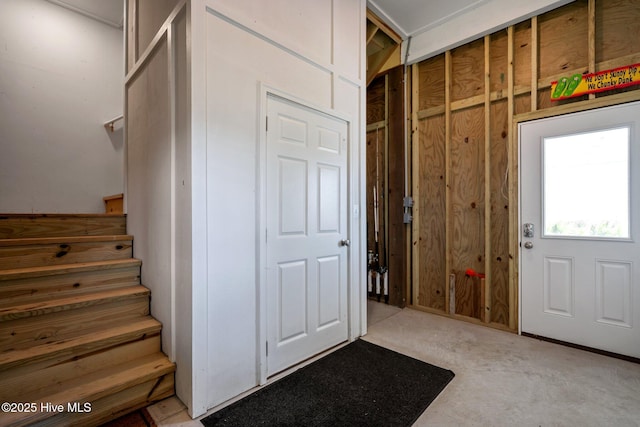 130 Raleigh St, Holden Beach, NC 28462 - entrance foyer featuring stairs