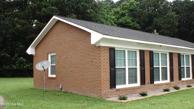 121 Walter Dr, Battleboro, NC 27809 - view of home's exterior featuring a yard, brick siding, and a shingled roof