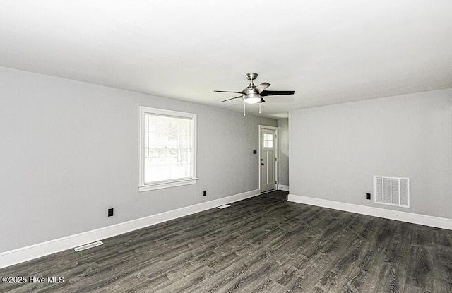 309 Mcgwigan St, Enfield, NC 27823 - unfurnished room featuring ceiling fan and dark wood-style flooring