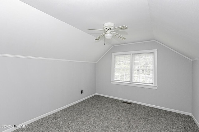 309 Mcgwigan St, Enfield, NC 27823 - bonus room with lofted ceiling, ceiling fan, and dark colored carpet