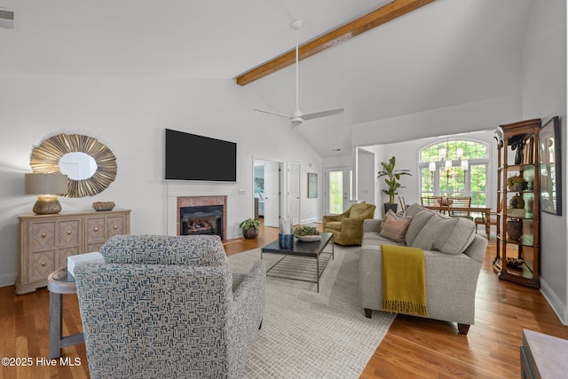 118 Tremayne Dr, New Bern, NC 28560 - living room with a fireplace, beamed ceiling, healthy amount of natural light, wood finished floors, and high vaulted ceiling