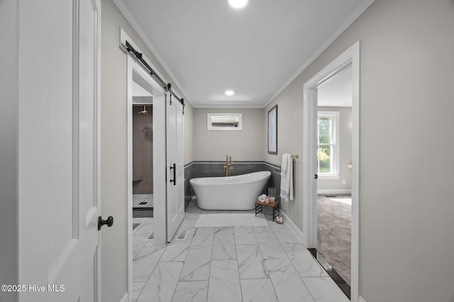 902 College St, Vanceboro, NC 28586 - bathroom with crown molding, marble finish flooring, a freestanding bath, a stall shower, and recessed lighting