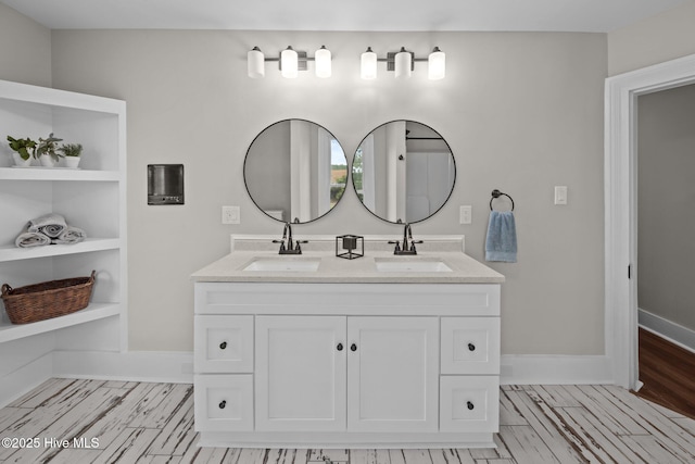 902 College St, Vanceboro, NC 28586 - bathroom featuring double vanity and wood finished floors