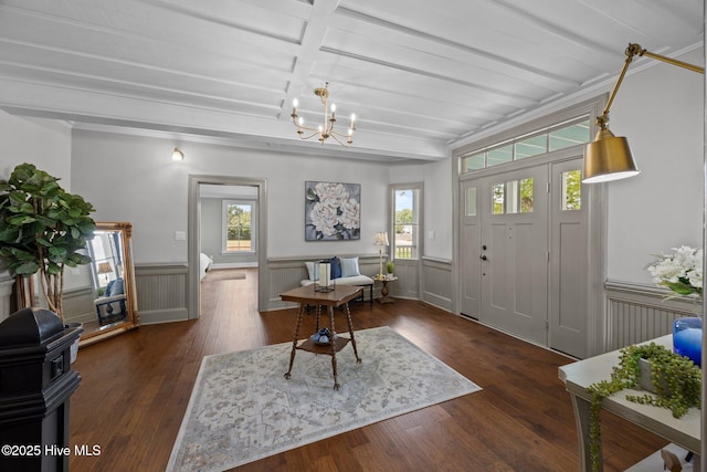 902 College St, Vanceboro, NC 28586 - entrance foyer with a chandelier, wainscoting, wood finished floors, and beam ceiling