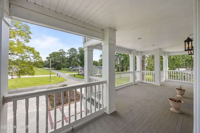 902 College St, Vanceboro, NC 28586 - wooden porch featuring a yard