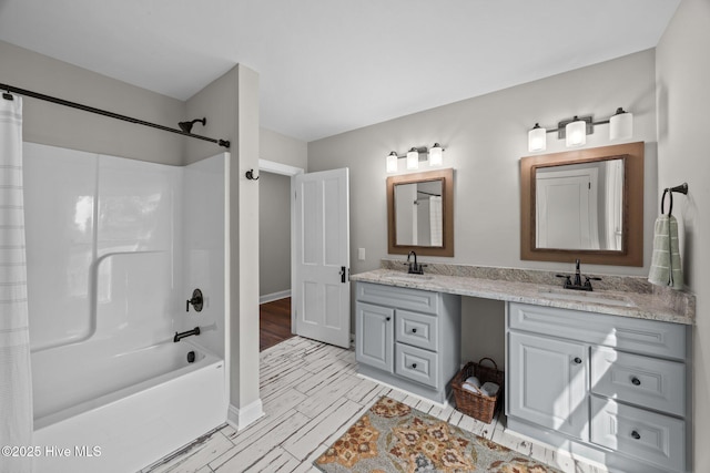 902 College St, Vanceboro, NC 28586 - bathroom featuring double vanity, shower / bath combination with curtain, and wood finished floors