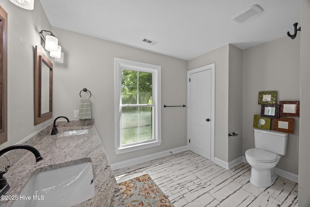 902 College St, Vanceboro, NC 28586 - bathroom with double vanity and marble look tile flooring