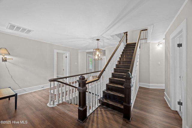 902 College St, Vanceboro, NC 28586 - staircase with wood finished floors and a chandelier