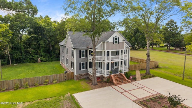 902 College St, Vanceboro, NC 28586 - back of property with a balcony, covered porch, and a shingled roof