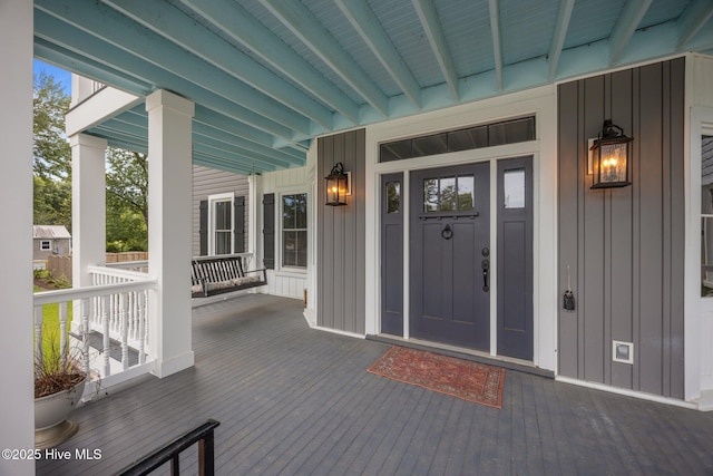 902 College St, Vanceboro, NC 28586 - view of exterior entry featuring board and batten siding and a porch
