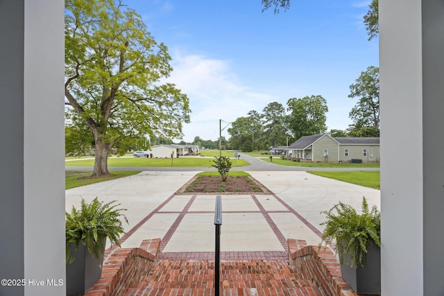 902 College St, Vanceboro, NC 28586 - view of green lawn featuring concrete driveway and a residential view