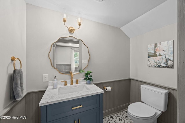 902 College St, Vanceboro, NC 28586 - half bathroom featuring a wainscoted wall, vanity, and vaulted ceiling
