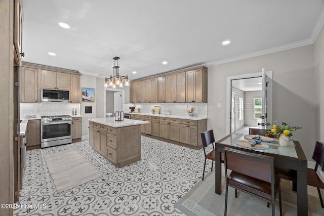 902 College St, Vanceboro, NC 28586 - kitchen with stainless steel appliances, decorative backsplash, crown molding, light countertops, and a chandelier