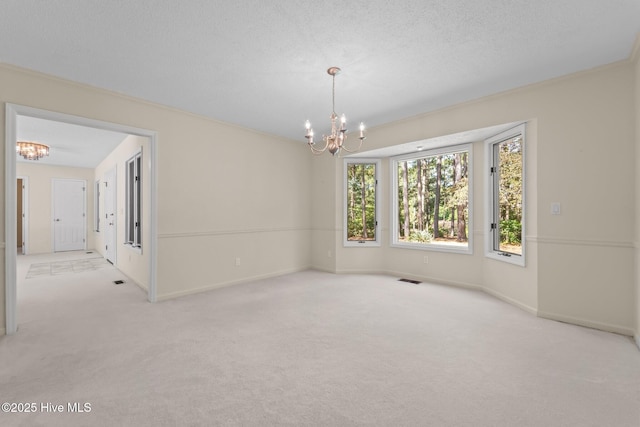 15 Magnolia Ave, Pinehurst, NC 28374 - carpeted spare room featuring a chandelier and a textured ceiling