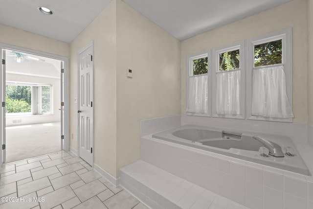 15 Magnolia Ave, Pinehurst, NC 28374 - bathroom featuring a bath, a ceiling fan, and tile patterned floors
