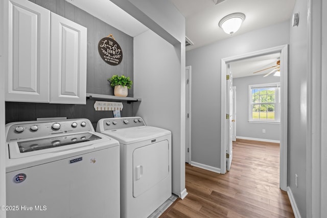 1134 Tebo Rd, New Bern, NC 28562 - washroom featuring washer and dryer, cabinet space, wood finished floors, and ceiling fan