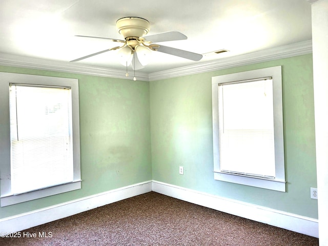 550 E Pungo St, Belhaven, NC 27810 - spare room featuring crown molding, dark colored carpet, and a ceiling fan