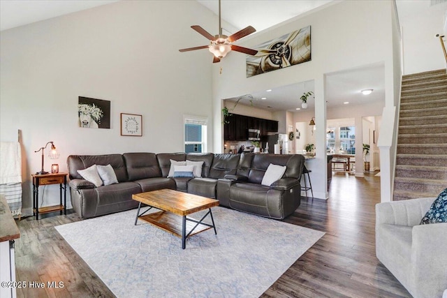 108 Bernier Ct, Princeton, NC 27569 - living area with stairway, wood finished floors, a ceiling fan, and high vaulted ceiling