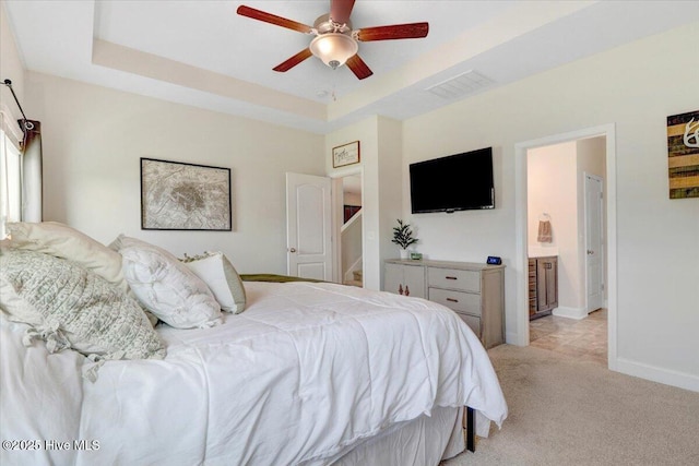 108 Bernier Ct, Princeton, NC 27569 - bedroom featuring light carpet, a raised ceiling, ceiling fan, and connected bathroom