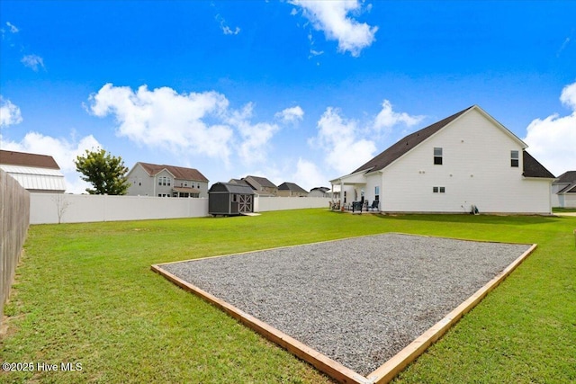 108 Bernier Ct, Princeton, NC 27569 - fenced backyard featuring a storage shed and a residential view