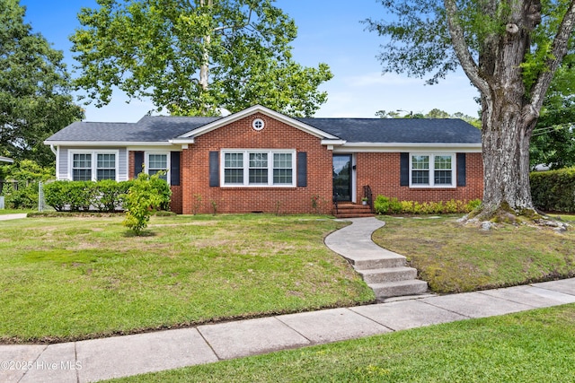 502 N 25th St, Wilmington, NC 28405 - ranch-style home featuring brick siding, a front yard, and roof with shingles