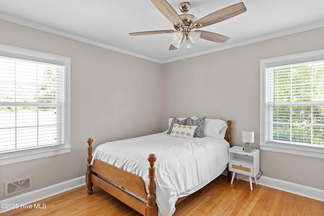 502 N 25th St, Wilmington, NC 28405 - bedroom with light wood-style flooring, crown molding, and a ceiling fan