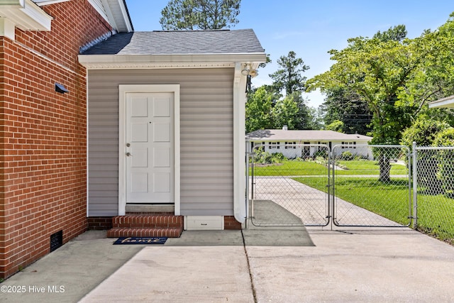502 N 25th St, Wilmington, NC 28405 - view of exterior entry with a gate and a shingled roof