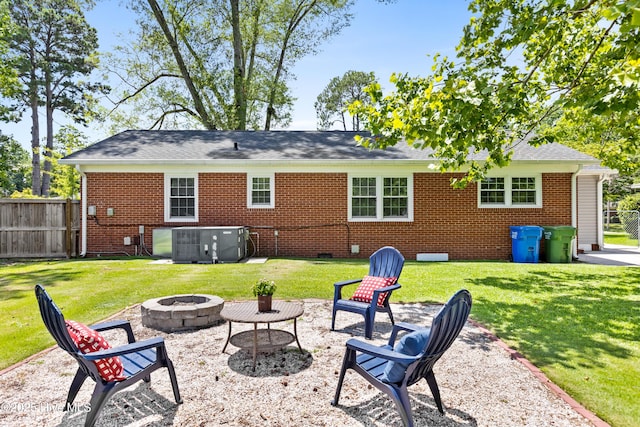 502 N 25th St, Wilmington, NC 28405 - rear view of house featuring a fire pit, brick siding, crawl space, and roof with shingles