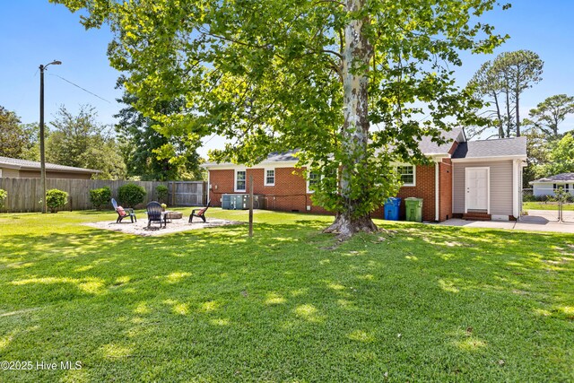 502 N 25th St, Wilmington, NC 28405 - view of yard with a fire pit and a patio area