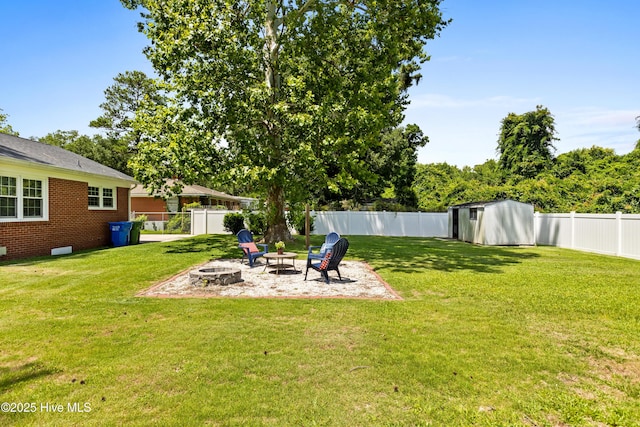 502 N 25th St, Wilmington, NC 28405 - fenced backyard with an outdoor fire pit and a storage shed