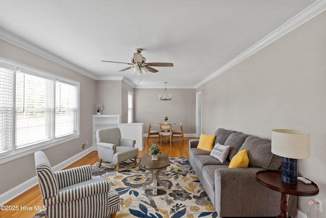 502 N 25th St, Wilmington, NC 28405 - living area featuring light wood-type flooring, ceiling fan, ornamental molding, and a chandelier