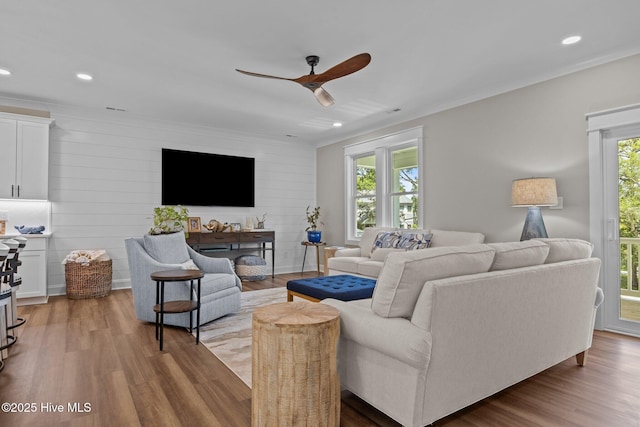 8805 Sound View Ct, Emerald Isle, NC 28594 - living area featuring a ceiling fan, healthy amount of natural light, wood finished floors, crown molding, and recessed lighting