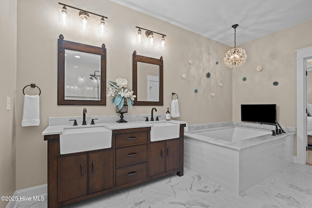8805 Sound View Ct, Emerald Isle, NC 28594 - bathroom with marble look tiles, a garden tub, double vanity, and a chandelier