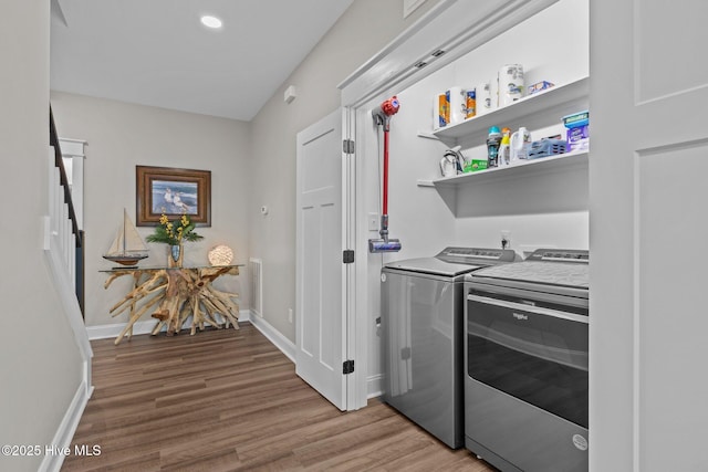 8805 Sound View Ct, Emerald Isle, NC 28594 - laundry area featuring washer and clothes dryer and light wood-style floors