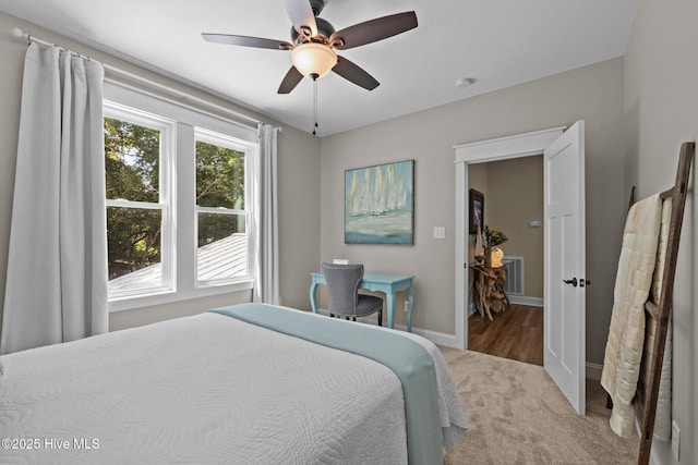 8805 Sound View Ct, Emerald Isle, NC 28594 - carpeted bedroom featuring baseboards and ceiling fan