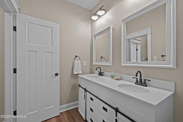 8805 Sound View Ct, Emerald Isle, NC 28594 - bathroom with double vanity and wood finished floors