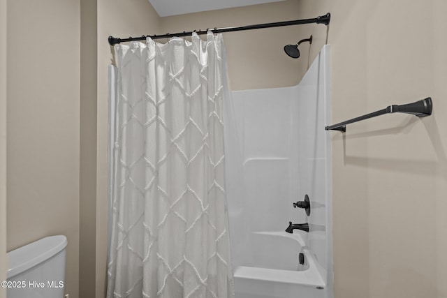 8805 Sound View Ct, Emerald Isle, NC 28594 - bathroom with shower / bath combination with curtain and toilet