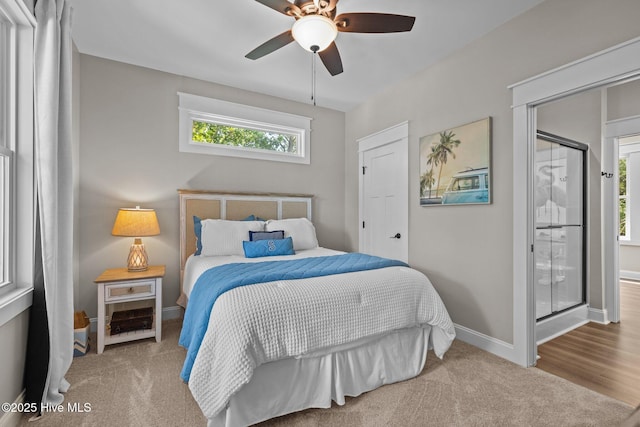 8805 Sound View Ct, Emerald Isle, NC 28594 - carpeted bedroom with baseboards and a ceiling fan
